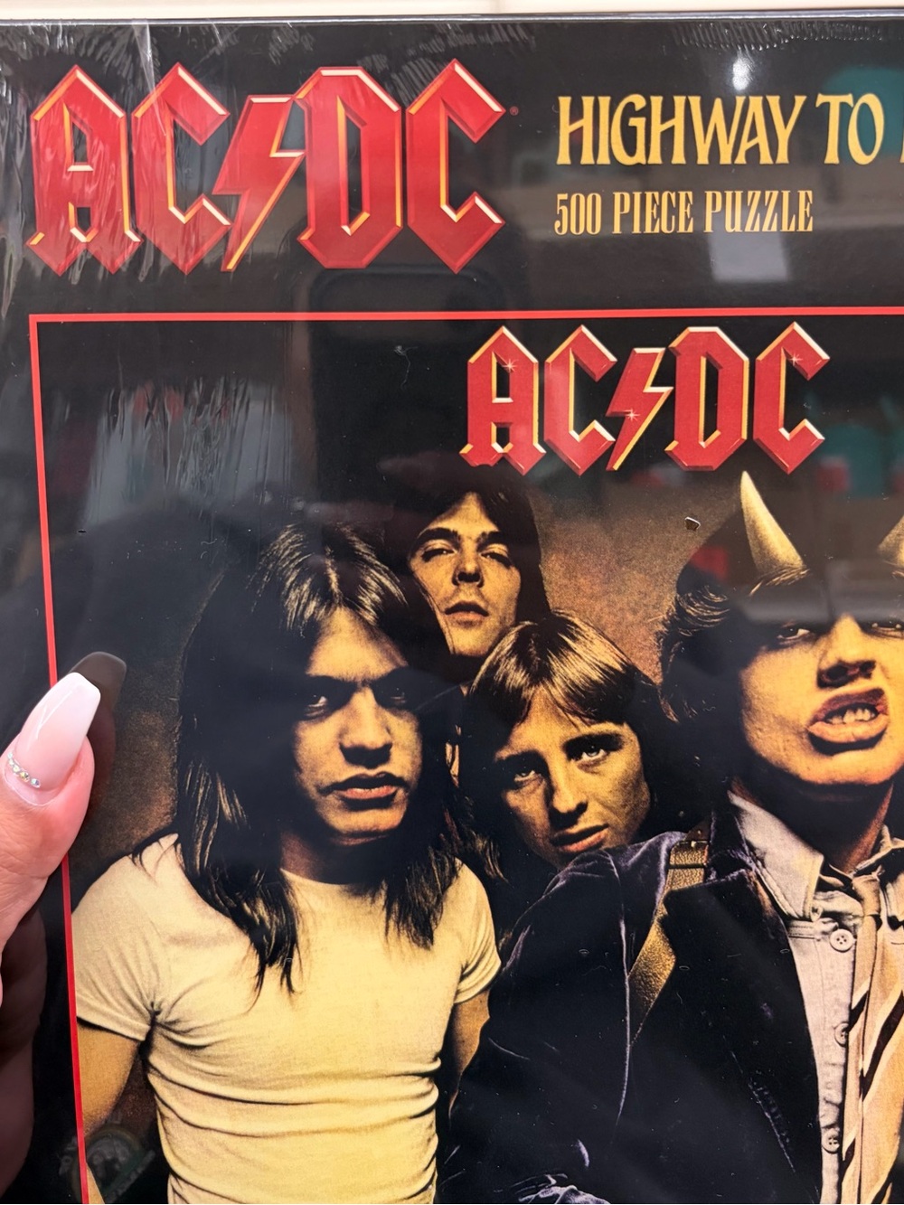 AC/DC puzzle - Black, Red, Gold Tones